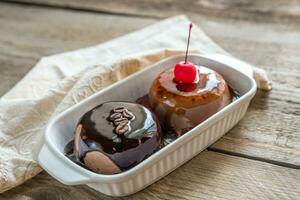 Coffee panna cotta under chocolate and strawberry topping photo