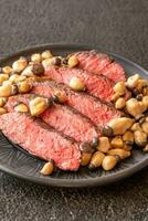 Steak rib eye with mushrooms photo