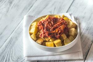 Portion of patatas bravas with sauces photo