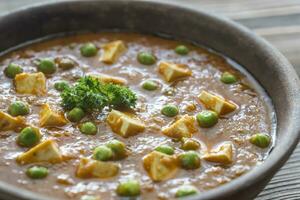 Bowl of mattar paneer photo