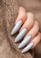 Woman's hand with grey nail polish photo