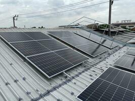 Solar panel on a roof, modern house and solar energy. photo