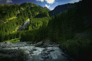 Grawa Waterfall with river photo