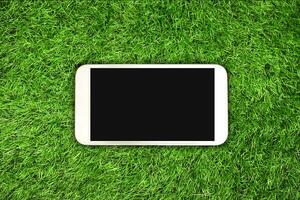 smartphone on grass photo