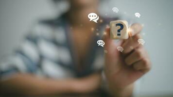 Businesswoman using question marks with speech bubbles.Q and A. Online service gives quick answers. FAQ concept photo