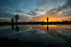 silhouette women at sunset photo