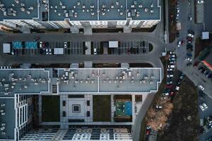 Residential building with parked cars photo