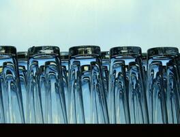 Crystal clear glass Placed on a blue background. photo