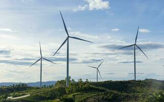 Wind turbines  on sunset background. Natural energy photo