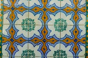 a close up of a blue and white tile floor photo