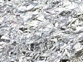 abstract background of crumpled silver foil texture photo