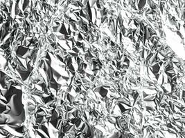 abstract background of crumpled silver foil texture photo