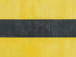 yellow painted cement wall background photo