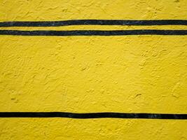 yellow painted cement wall background photo