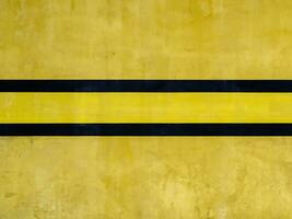 yellow painted cement wall background photo