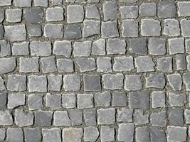 close up old cobblestone pavement texture. photo