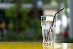 glass of water on a  table photo