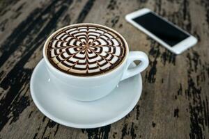 cups of mocha coffee on wood table photo