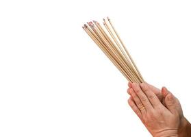 Asian women holding burning incense photo