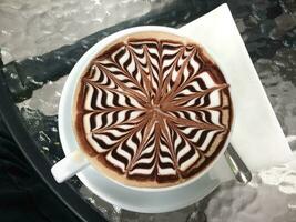 Cup of mocha coffee on table photo