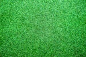 Artificial lawn grass green bright background photo