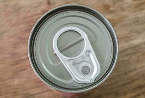 Tin can lid close on table photo