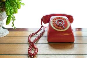 Red telephone vintage old style on table photo