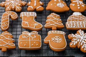 Beautiful delicious sweet winter Christmas gingerbread cookies on a gray textured background photo