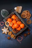 Beautiful festive Christmas composition of tangerines, gingerbread and star anise photo