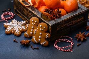 Beautiful festive Christmas composition of tangerines, gingerbread and star anise photo