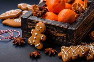 Beautiful festive Christmas composition of tangerines, gingerbread and star anise photo