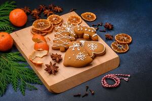 Beautiful festive Christmas composition of tangerines, gingerbread and star anise photo