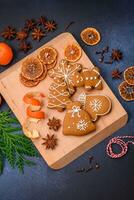 Beautiful festive Christmas composition of tangerines, gingerbread and star anise photo