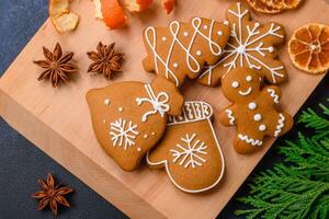 Beautiful festive Christmas composition of tangerines, gingerbread and star anise photo