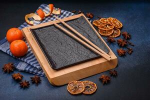 Beautiful festive Christmas composition of an empty plate, tangerine and gingerbreads photo