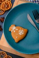 Beautiful festive Christmas composition of an empty plate, tangerine and gingerbreads photo