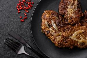 Delicious fried chicken or beef liver with salt, spices and herbs photo