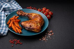 Delicious grilled chicken leg or quarter with salt and spices photo