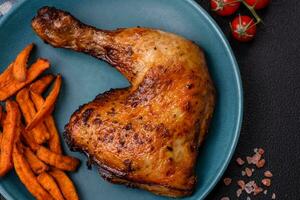 Delicious grilled chicken leg or quarter with salt and spices photo