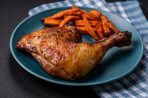 Delicious grilled chicken leg or quarter with salt and spices photo