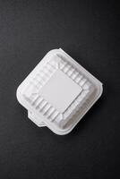 Square plastic or cardboard container of white color for food photo