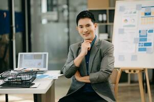 Modern business Asian man in the modern office with copy space photo