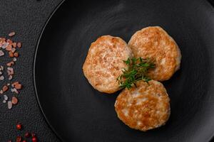 Fried meatballs of minced meat beef, pork or chicken with salt, spices and herbs photo