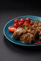 Delicious fried shish kebab of chicken or pork meat with salt, spices and herbs photo