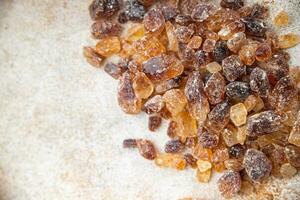 rock sugar crystals pieces candy brown sugar candied big rock caramel taste cane sugar healthy eating cooking appetizer meal food snack on the table photo