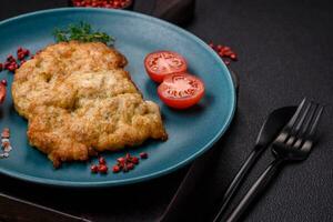 Delicious baked chicken or turkey chops with salt, spices and herbs photo