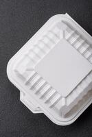 Square plastic or cardboard container of white color for food photo