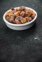 rock sugar crystals pieces candy brown sugar candied big rock caramel taste cane sugar healthy eating cooking appetizer meal food snack on the table photo