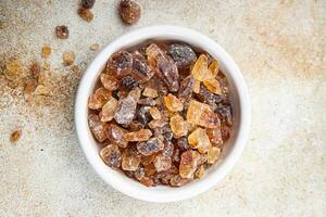 rock sugar crystals pieces candy brown sugar candied big rock caramel taste cane sugar healthy eating cooking appetizer meal food snack on the table photo