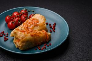 Delicious cabbage rolls with meat, rice, salt, spices and herbs photo